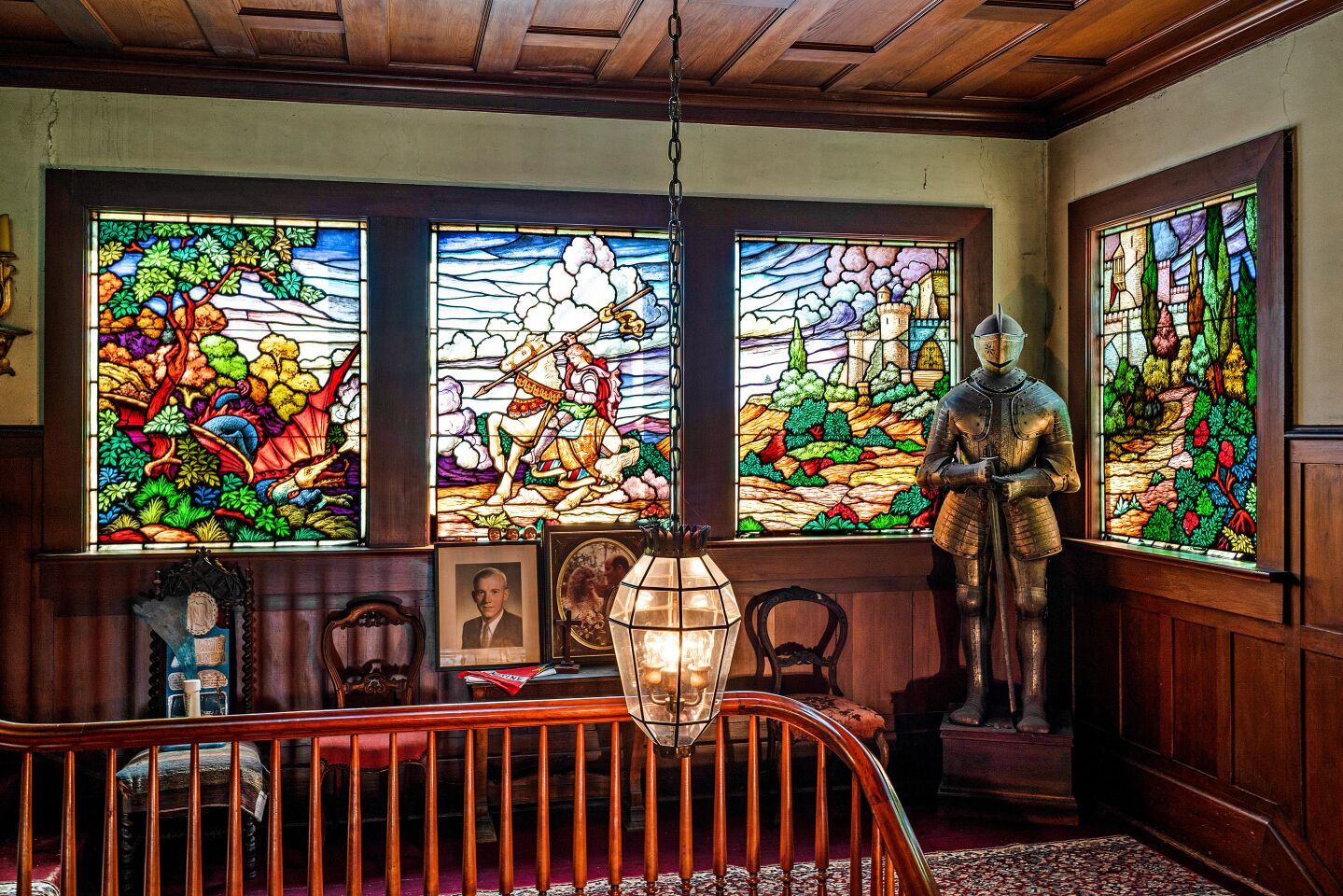 The residence features period details such as stained-glass windows.