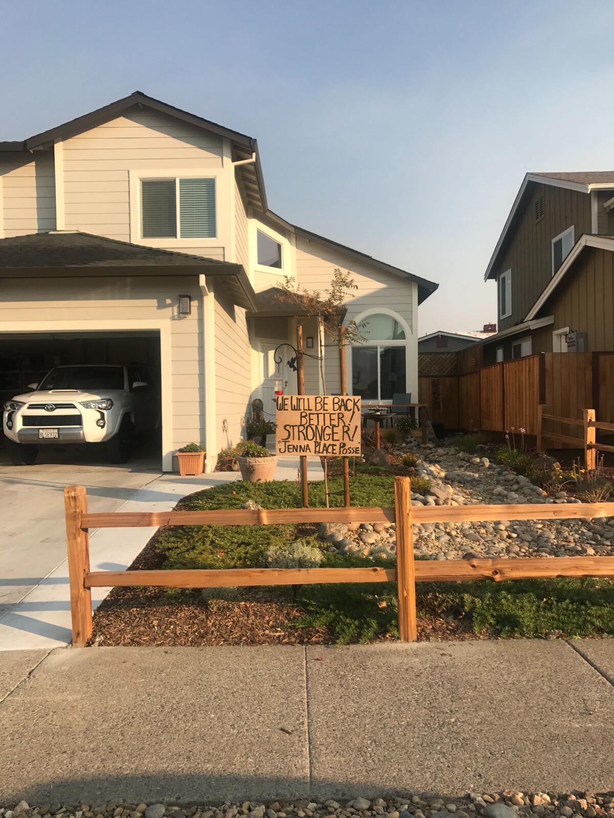Alongside dozens of others, the Serdins in January finished rebuilding their home, which had been destroyed in the 2017 Tubbs fire. Debbie Serdin hung a sign that had been posted outside her previous home as the Kincade fire posed a new threat.