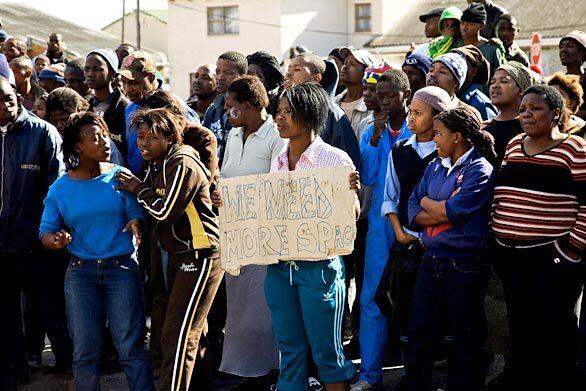 Residents of the Masiphunelele shack settlement protest their living conditions.