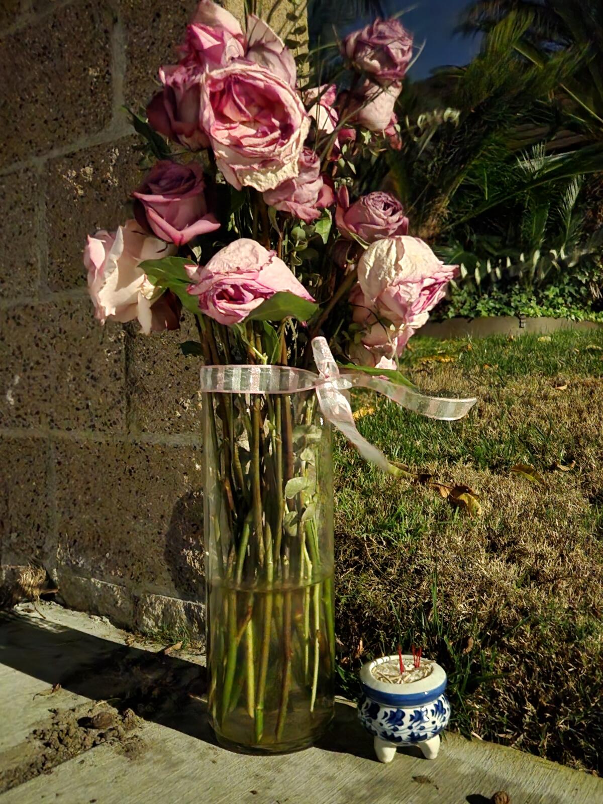 Flowers left on the corner of Los Coches Street and Sunn Avenue, the site of a fatal traffic collision in Fountain Valley.