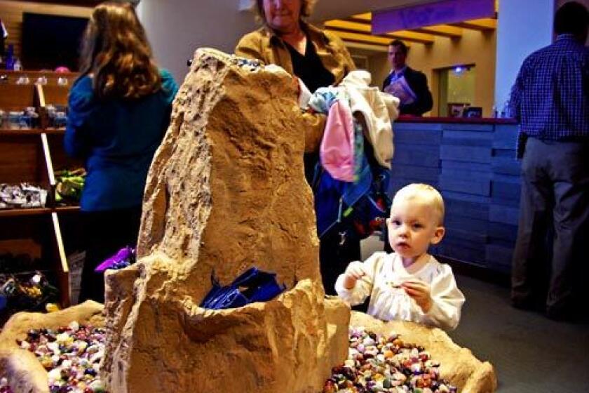 SMOOTH: The Fort Worth Museum of Science and History has cutting-edge exhibits for kids. A young museum store shopper checks out some polished stones.