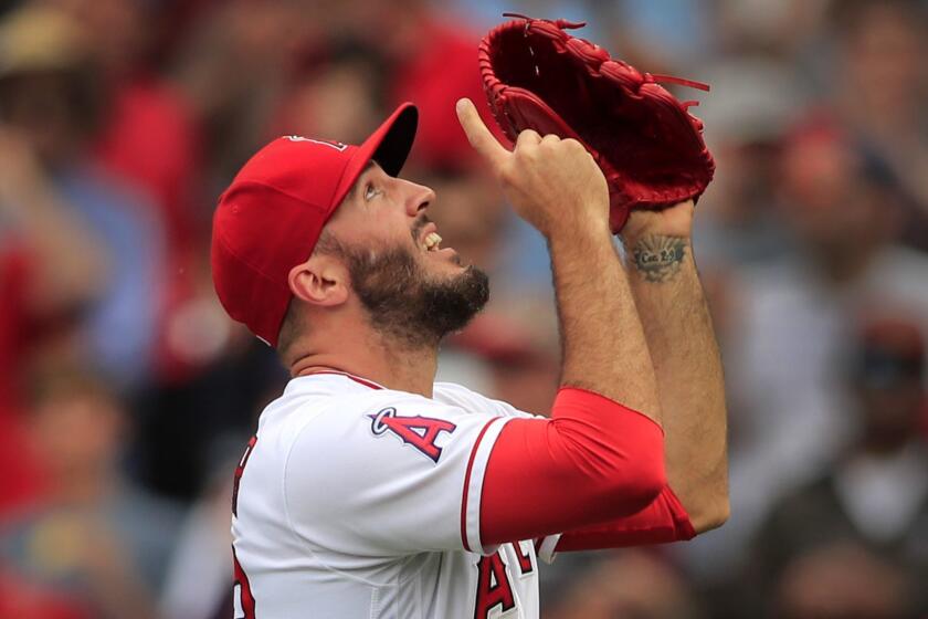 ANAHEIM, CALIF. -- SUNDAY, MAY 20, 2018: Angels relief pitcher Blake Parker points skyward as he celebrates beating the Tampa Bay Rays 5-2 and his final strike out in the nineth iinning at Angel Stadium in Anaheim, Calif., on May 20, 2018. (Allen J. Schaben / Los Angeles Times)