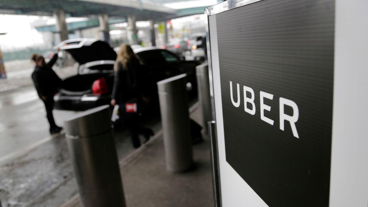 A British panel ruled that Uber's drivers are workers, not independent contractors.