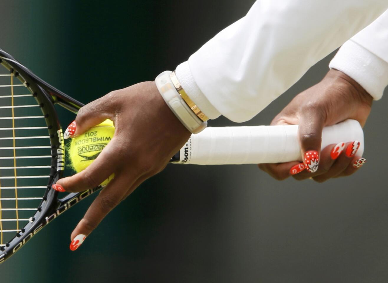 Serena Williams of the U.S. warms up before her women's singles tennis match against Caroline Garcia of France at the Wimbledon Tennis Championships, in London