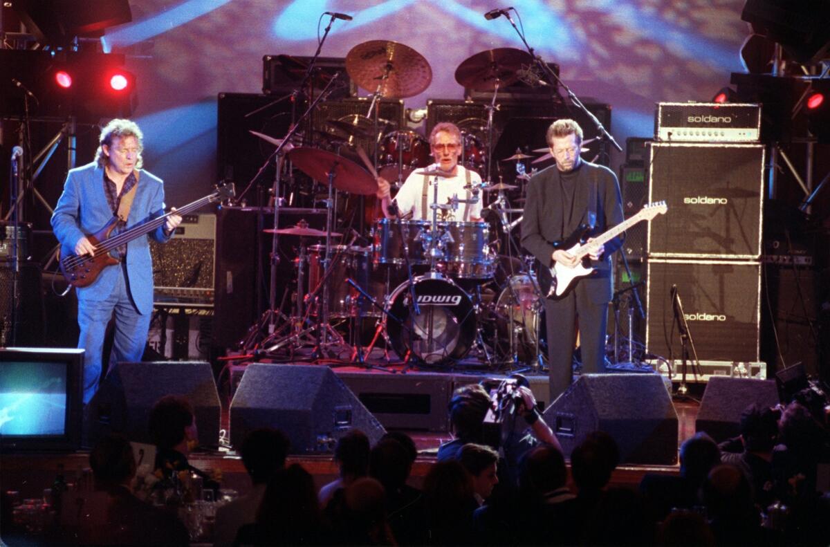 In this 1993 file photo, members of the rock group Cream perform in Los Angeles during the 8th Annual Rock and Roll Hall of Fame induction ceremony in Los Angeles. Shown from left are Jack Bruce, Ginger Baker and Eric Clapton.