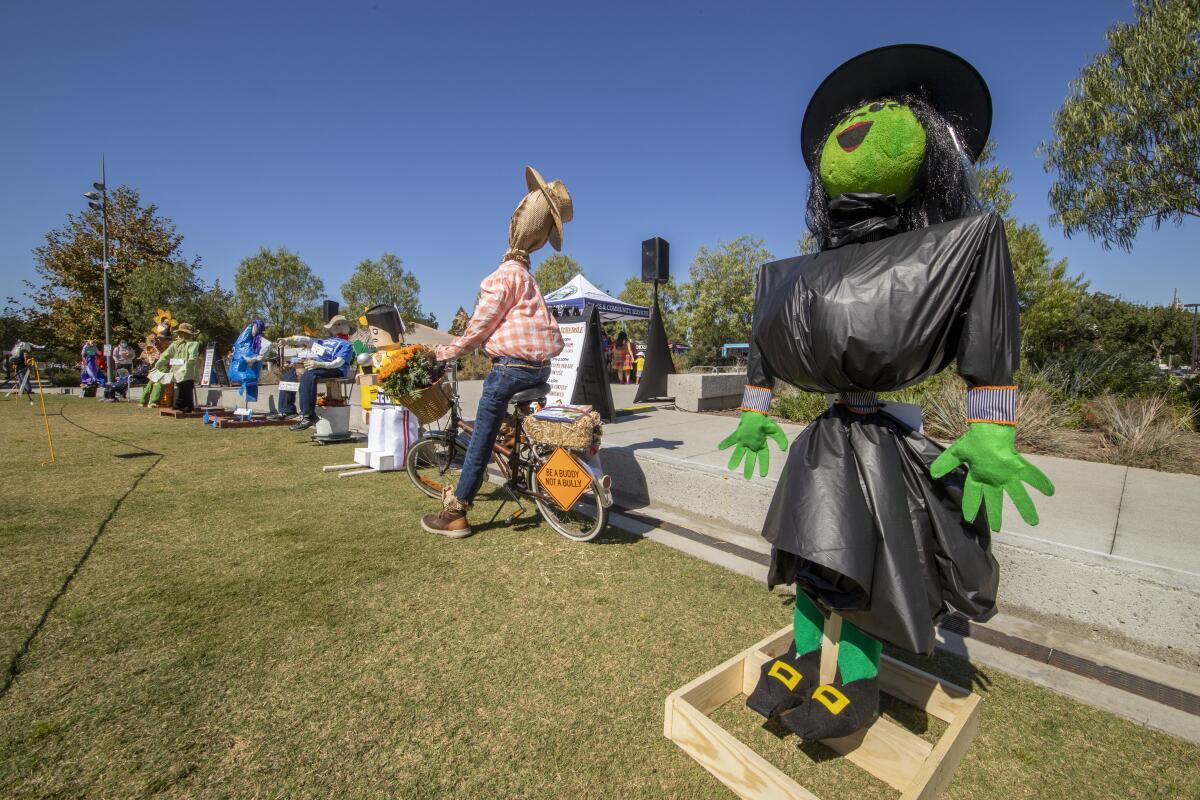 A line of scarecrows at Costa Mesa's Lions Park in October 2021 waiting to be judged.