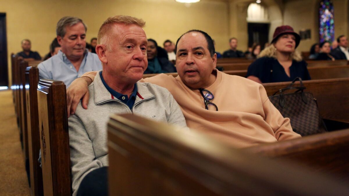 Churchgoers Henry Fries, left, and his husband, Richard Lopez, at Hollywood United Methodist Church on March 3, 2019.