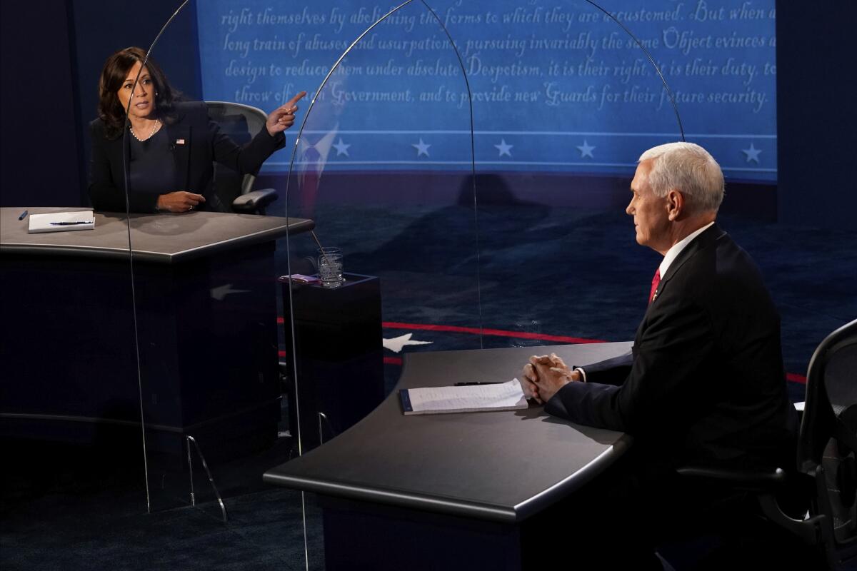  Sen. Kamala Harris gestures toward Vice President Mike Pence during the vice presidential debate Wednesday.