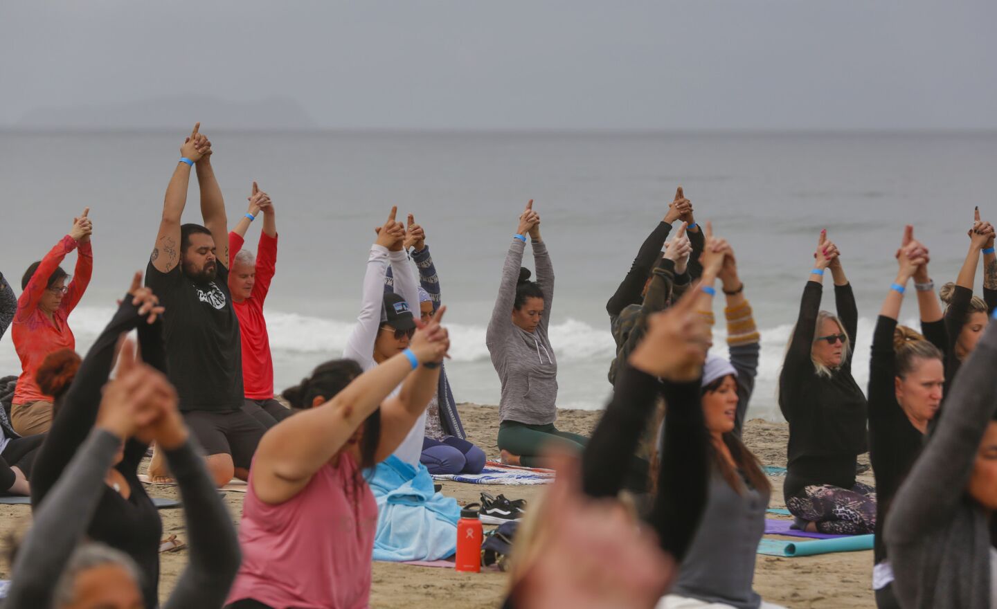 At the San Diego Yoga Festival held in Imperial Beach, several participants took part in morning yoga session held Sunday morning on the sand near the Imperial Beach Pier.