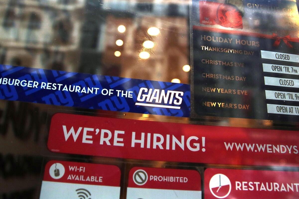 A New York City restaurant advertises for a job opening.