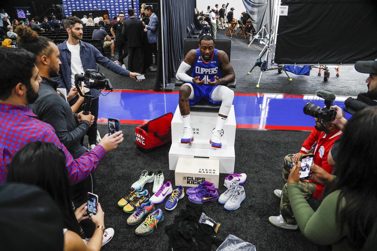 John Wall talks with reporters during media day for the Clippers.