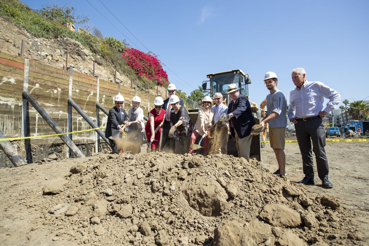 College officials and other dignitaries break ground Monday for Orange Coast College's new Professional Mariner Training Center in Newport Beach.