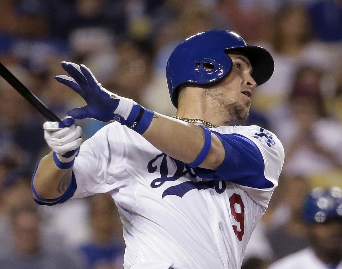 Dodgers catcher Yasmani Grandal watches his two-run home run against the Philadelphia Phillies during the sixth inning of a game on July 7 at Dodger Stadium.