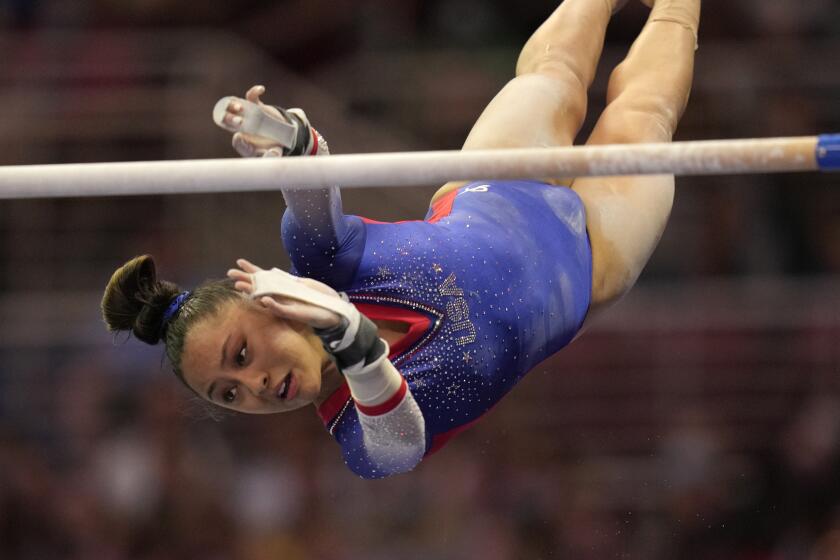 Emma Malabuyo competes on the uneven bars during the women's U.S. Olympic Gymnastics Trials.