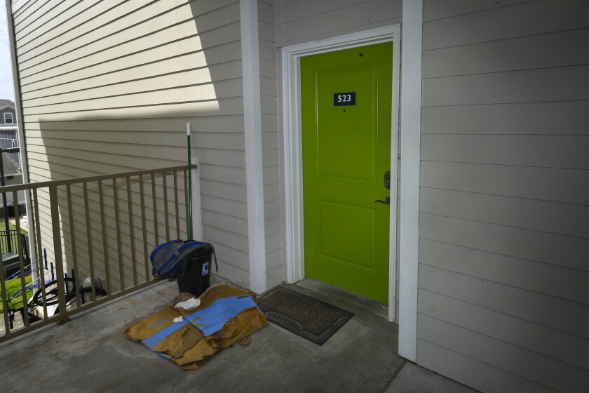 The front door of an apartment where former U.S. Marine Willy Joseph Cancel lived in Murray, Ky. 