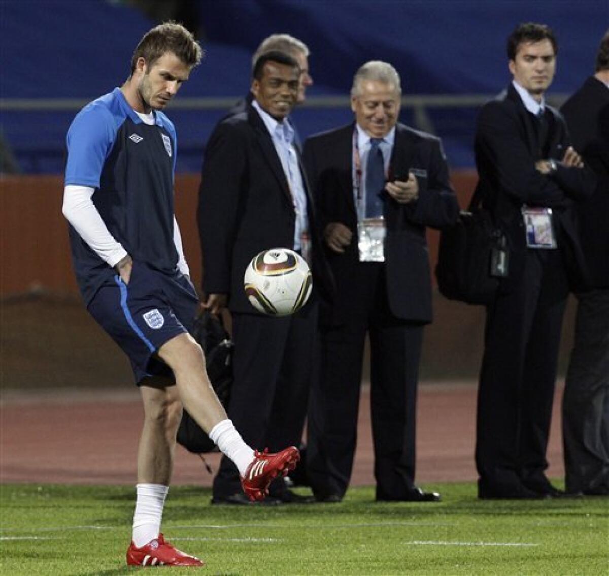 David Beckham kicks a ball on the sidelines as England trains at the Royal Bafokeng Stadium in Rustenburg, South Africa Friday, June 11, 2010. England will play the U.S. in a soccer World Cup Group C match on Saturday. (AP Photo/Elise Amendola)