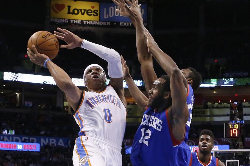 Oklahoma City guard Russell Westbrook shoots in front of Philadelphia 76ers forward Luc Richard Mbah a Moute on Wednesday night.