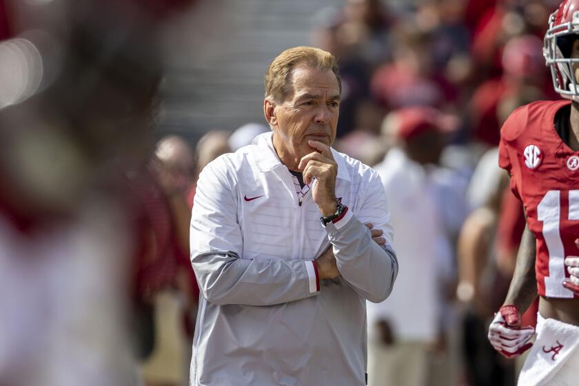 Alabama coach Nick Saban watches his team warm up before playing Tennessee on Oct. 21 in Tuscaloosa, Ala. 