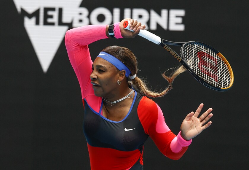 Serena Williams hits a return during her victory over Laura Siegemund in the first round of the Australian Open on Monday.