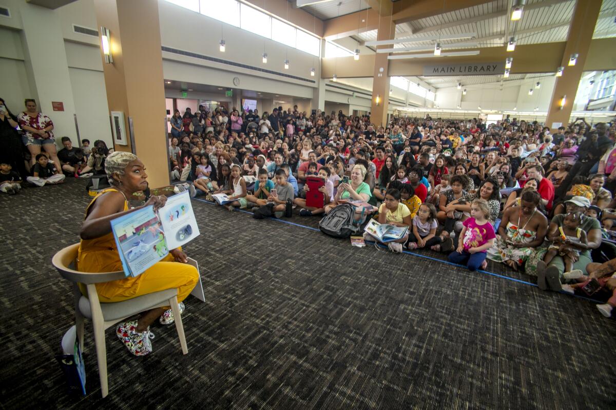 Tiffany Haddish reads "Layla, the Last Black Unicorn" to her fans at the Tustin Library.
