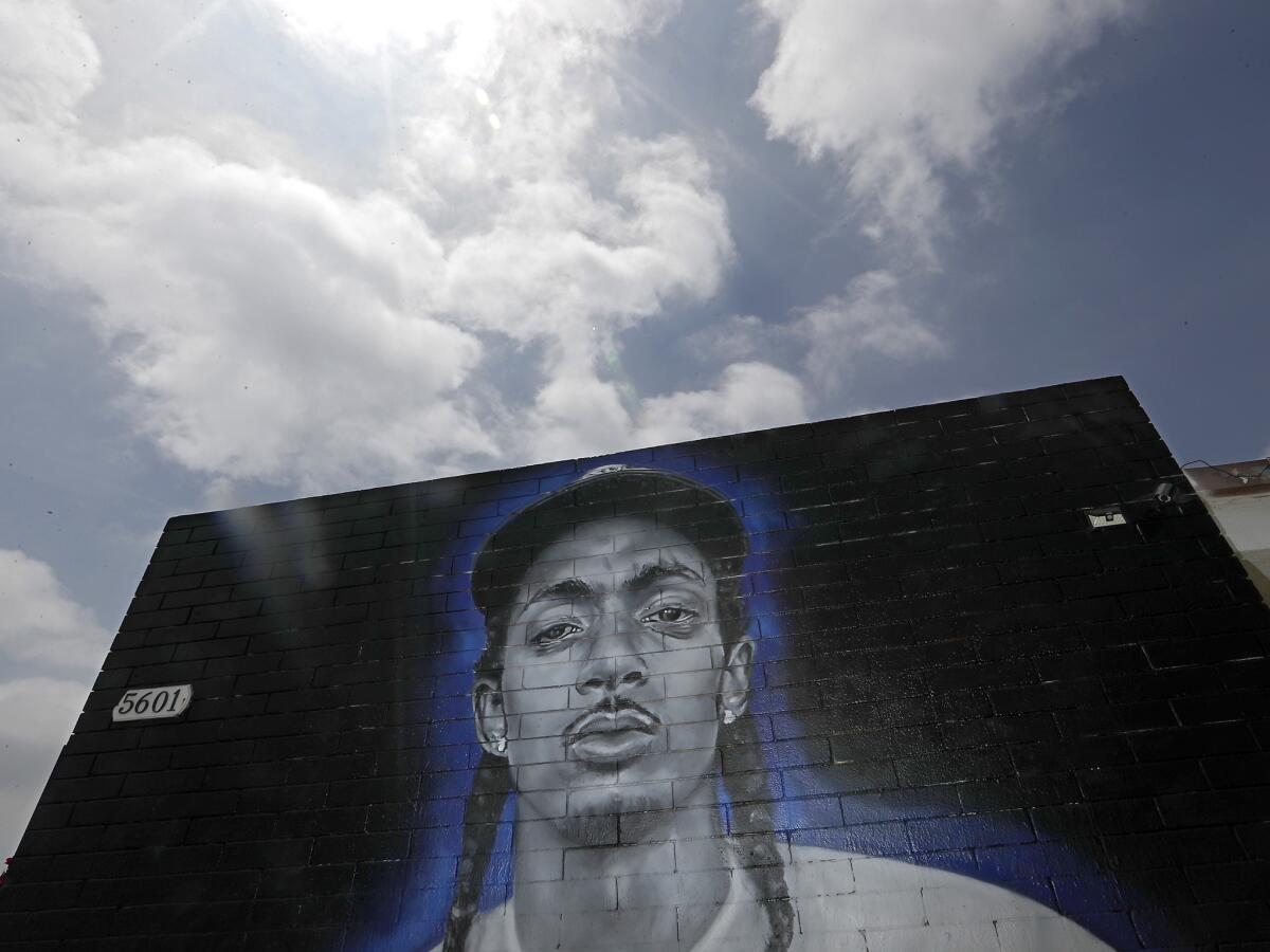 A mural of Nipsey Hussle decorates the wall of a building at 5601 Washington Blvd. (Luis Sinco / Los Angeles Times)