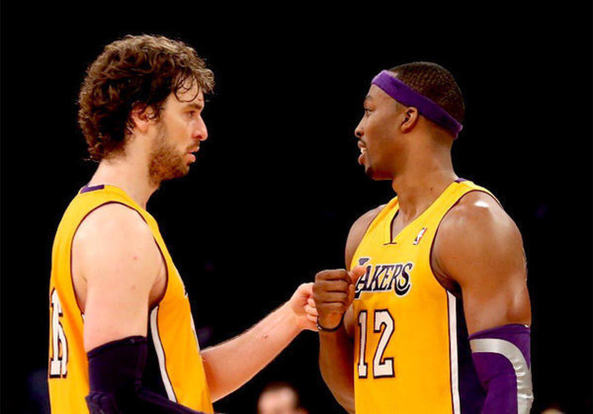 Lakers big men Pau Gasol, left, and Dwight Howard have been out of the lineup for most of January.
