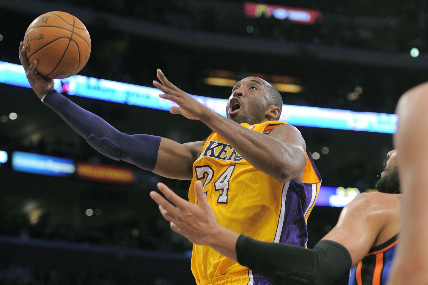 Kobe Bryant goes up for a shot over New York Knick Tyson Chandler.