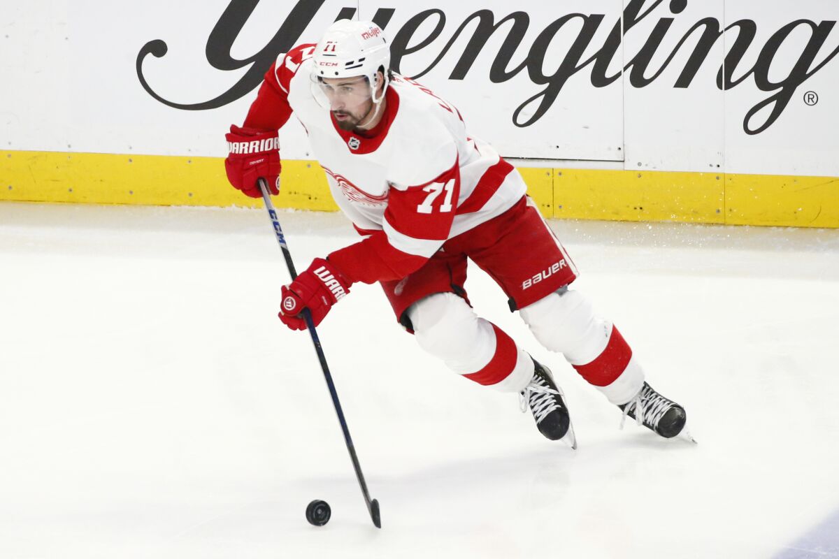 Detroit Red Wings center Dylan Larkin (71) carries the puck during the third period of an NHL hockey game against the Buffalo Sabres, Monday, Jan. 17, 2022, in Buffalo, N.Y. (AP Photo/Jeffrey T. Barnes)