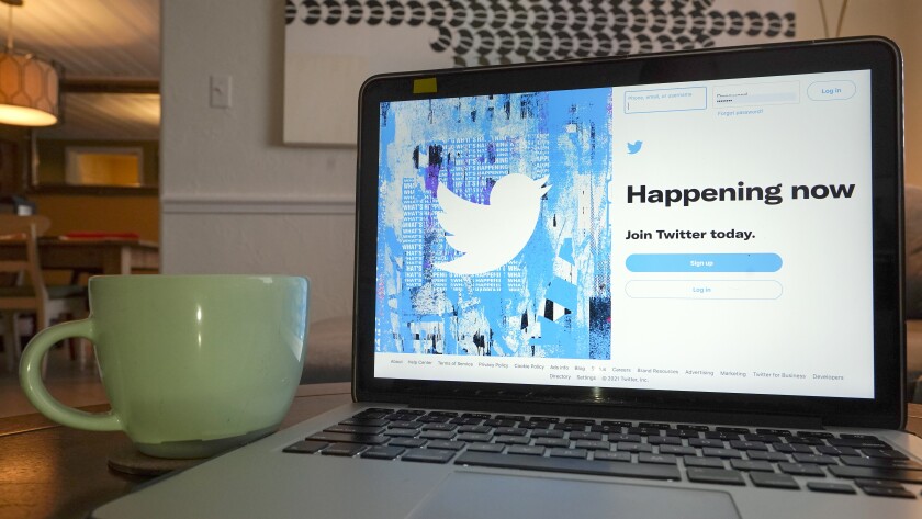 The login/sign up screen for a Twitter account is seen on a laptop computer Tuesday, April 27, 2021, in Orlando, Fla. Twitter is rolling out a subscription service, starting in Canada and Australia, that offers perks like an undo button for subscribers. (AP Photo/John Raoux)