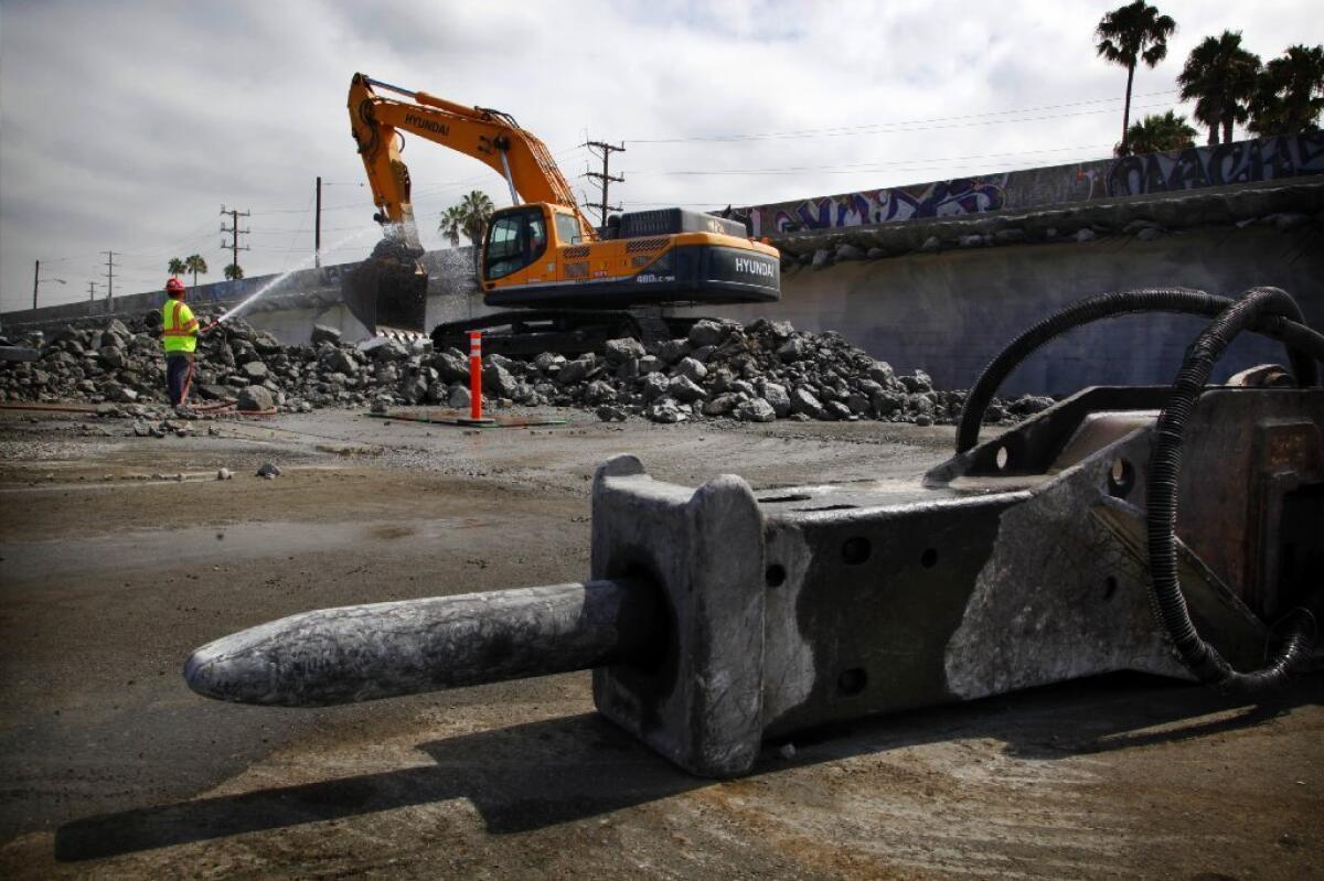 Construction workers earlier this week began demolition of an old railroad bridge at the intersection of Century and Aviation boulevards near the entrance to Los Angeles International Airport. The intersection will be closed until 6 a.m. Monday.