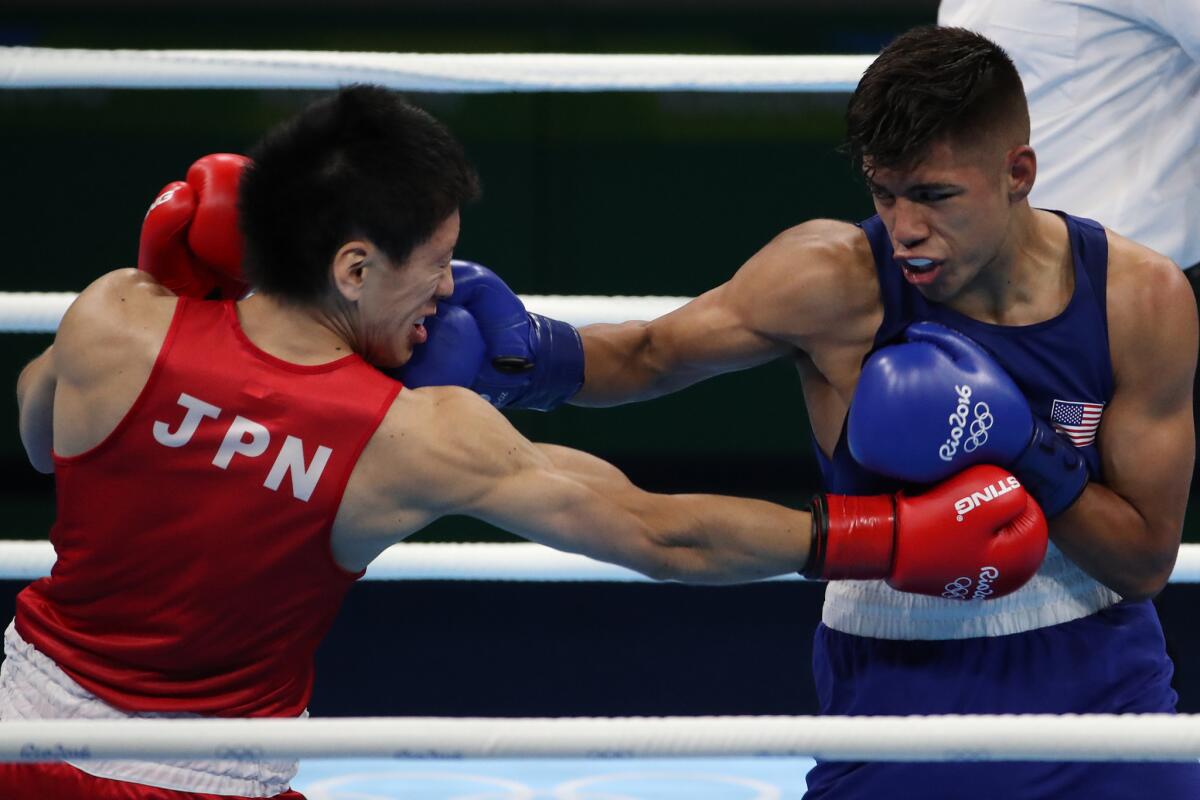 Carlos Balderasfights Japan's Daisuke Narimatsu during the Rio Olympics.
