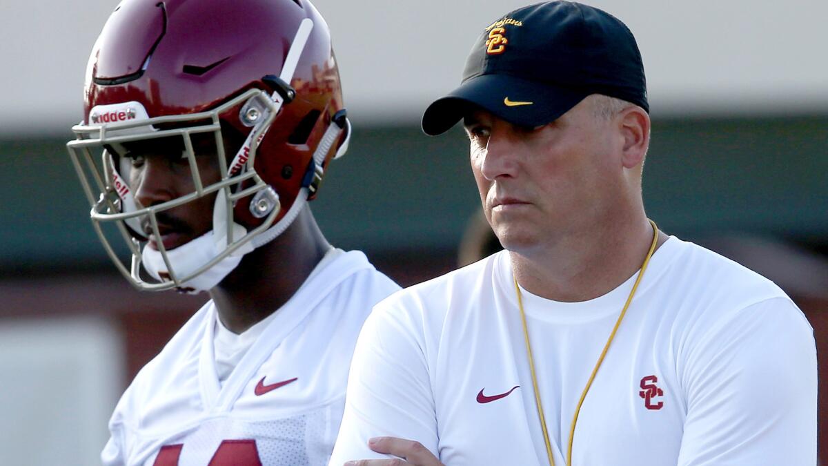 Coach Clay Helton watches USC's first summer practice on Thursday at Howard Jones Field.