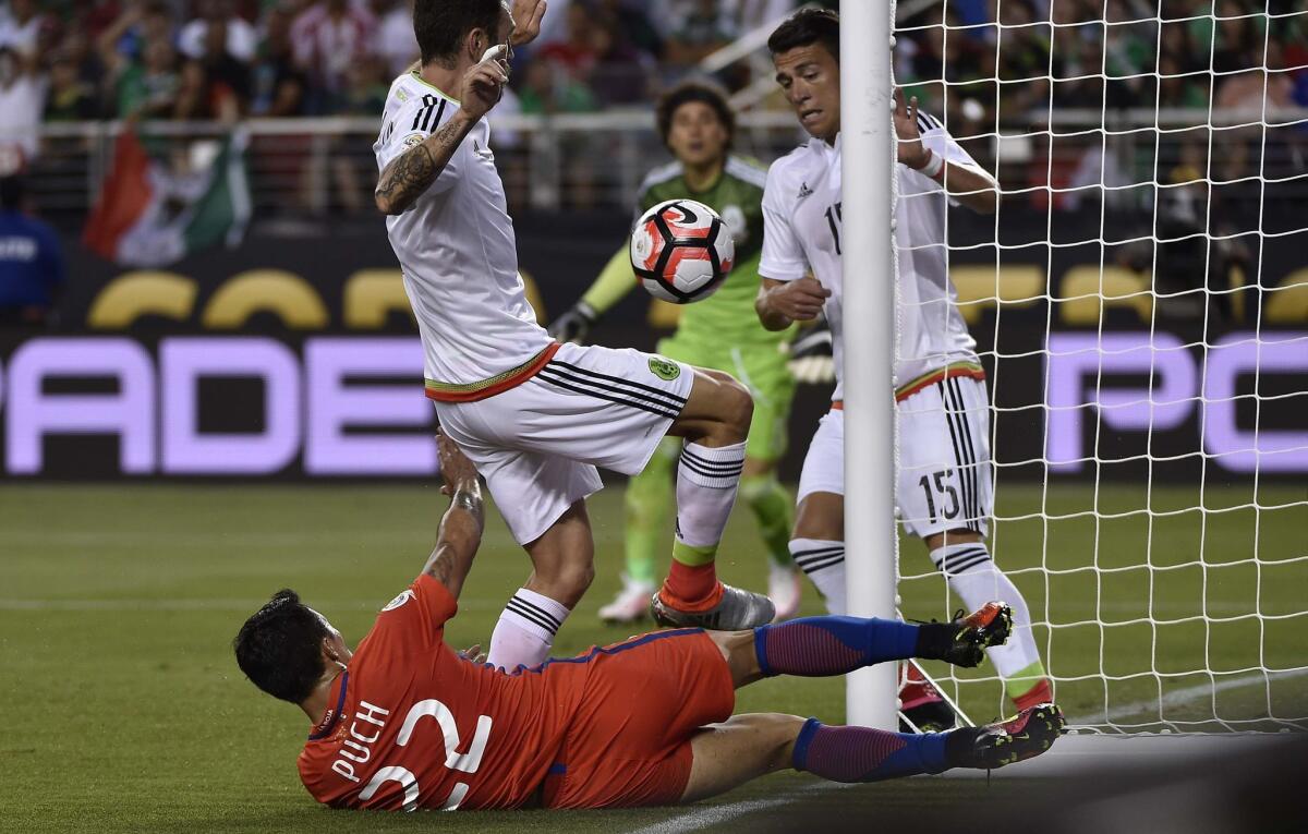 Mexico's Hector Moreno (R) and Chile's Edson Puch vie for the ball during the Copa America Centenario quarterfinal football match in Santa Clara, California, United States, on June 18, 2016. / AFP PHOTO / OMAR TORRESOMAR TORRES/AFP/Getty Images ** OUTS - ELSENT, FPG, CM - OUTS * NM, PH, VA if sourced by CT, LA or MoD **