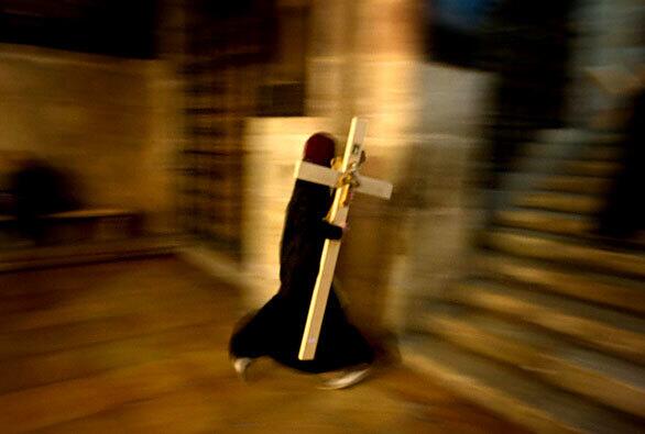 Protestants and Roman Catholics marked Good Friday last week, but members of Orthodox Christian churches follow a different calendar. Here, an Orthodox believer carries a wooden cross into the Church of the Holy Sepulchre during a Good Friday procession in Jerusalem's Old City. Thousands of pilgrims took part in processions along the route where according to tradition Jesus Christ carried the cross before his crucifixion.