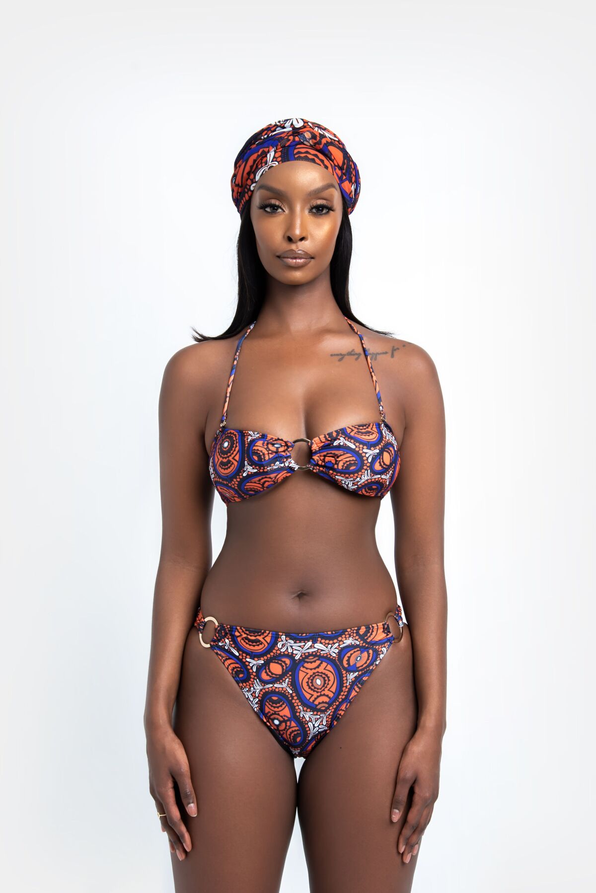 Öfuurë's Semira top and bottom features a blue, orange, and white African print