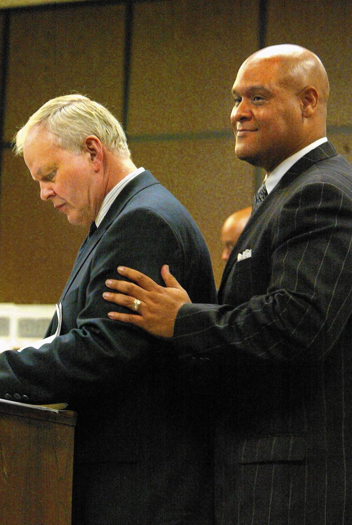 Attorney Ben Pesta, left, appears in court in 2004 with former Compton Mayor Omar Bradley, who was accused of misappropriating public funds while mayor.