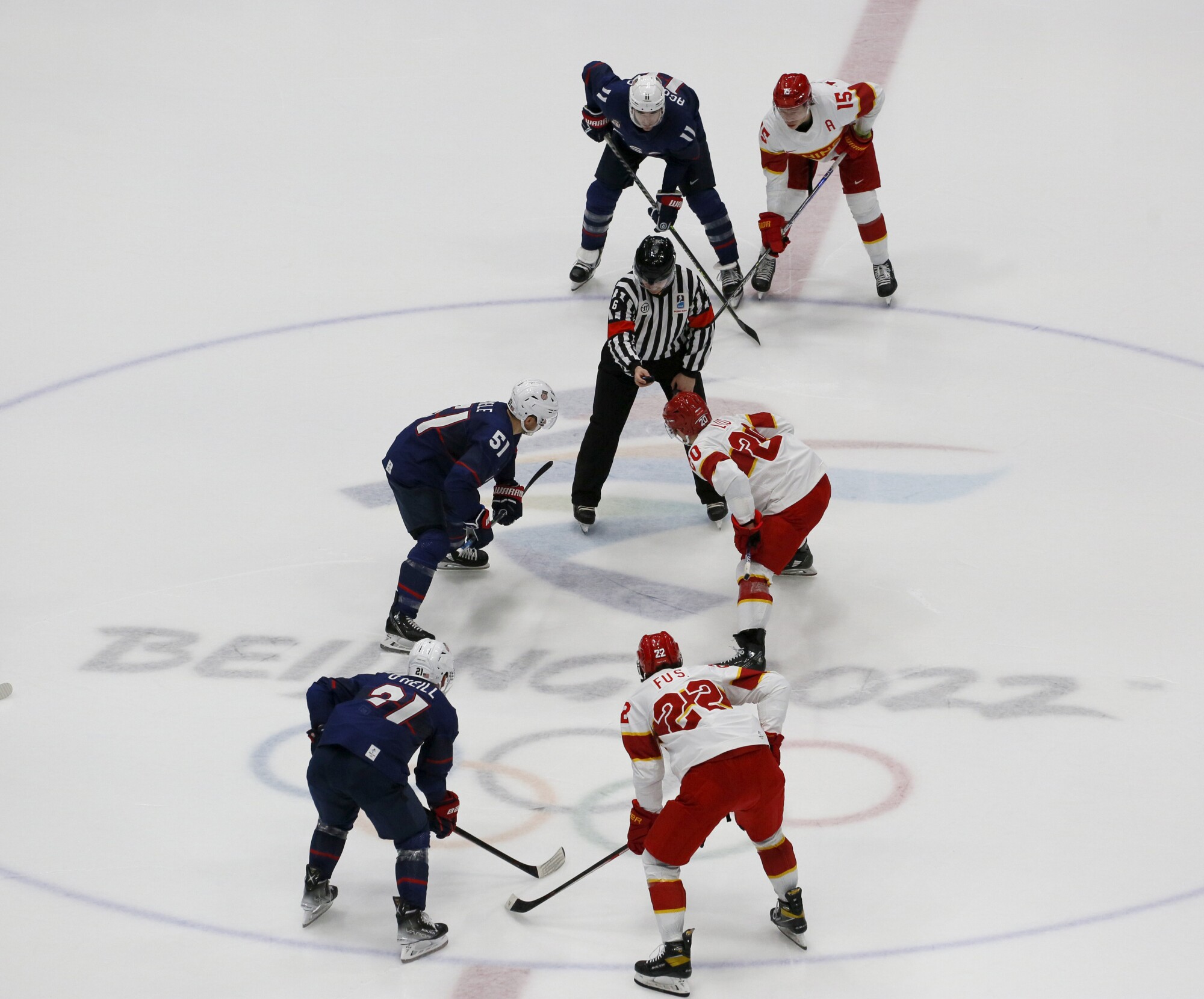 Players from the United States, left, and China face off during a preliminary-round game on Thursday.