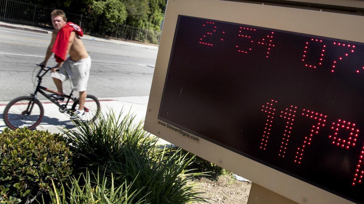 A message board at Calvary Church on Shoup Avenue reads 117 degrees in West Hills.