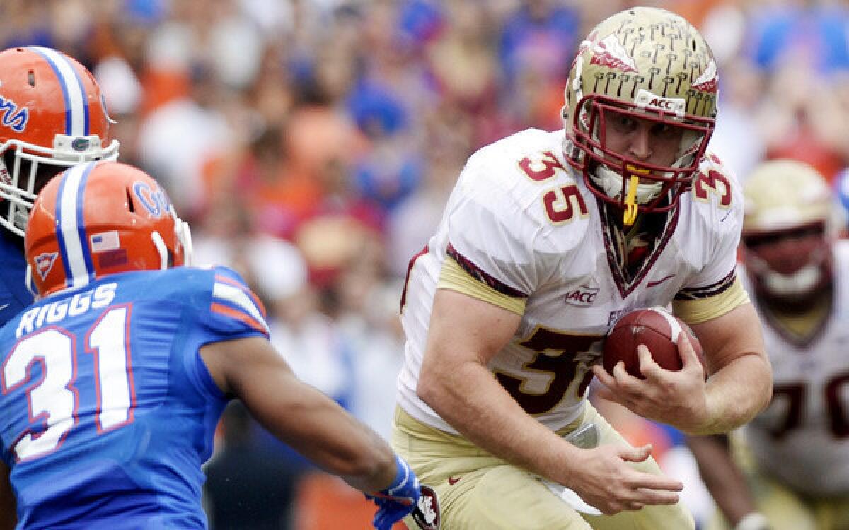 Florida State tight end Nick O'Leary (35) heads up field after a catch against Florida defensive back Cody Riggs during a game earlier this season.