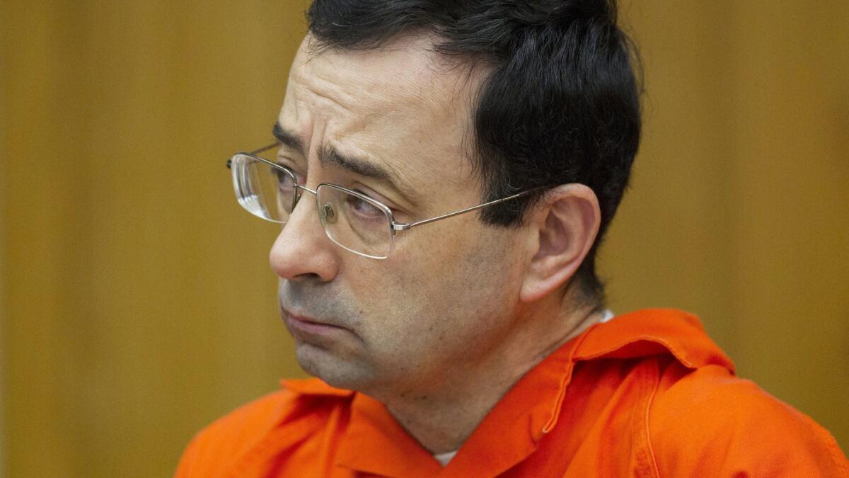 Dr. Larry Nassar at his sentencing in January. William Strampel, a top Michigan State University official, has been arrested amid an investigation into the handling of complaints against now-imprisoned Nassar.