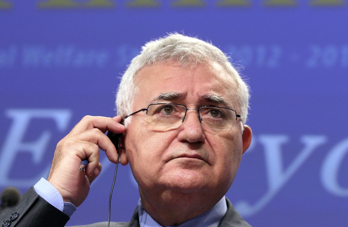 FILE - European Commissioner for Health and Consumer Policy John Dalli addresses the media at the European Commission headquarters in Brussels Jan. 19, 2012. A former European Union health commissioner has on Wednesday, Feb. 9, 2022 pleaded innocent in a Maltese courtroom to charges of bribery and influence trading bribery charges. John Dalli, who is Maltese, served in the commission post from 2010 to 2012. (AP Photo/Yves Logghe, file)