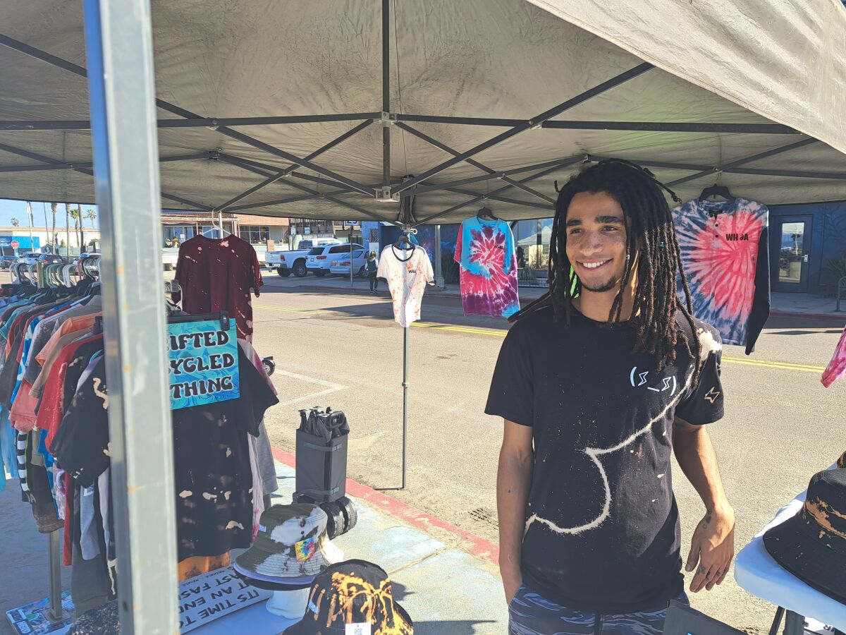 Wasani Guerrero sells his brand of upcycled apparel on Jan. 18 in Ocean Beach.