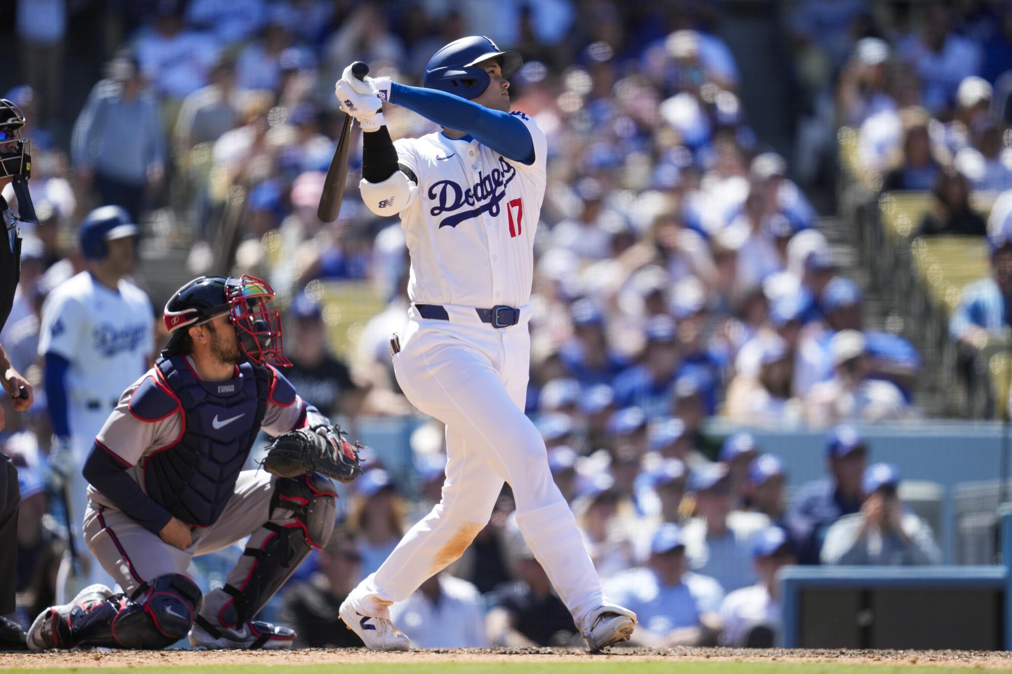 Dodgers designated hitter Shohei Ohtani follows through on a home-run swing in the eighth inning Sunday.