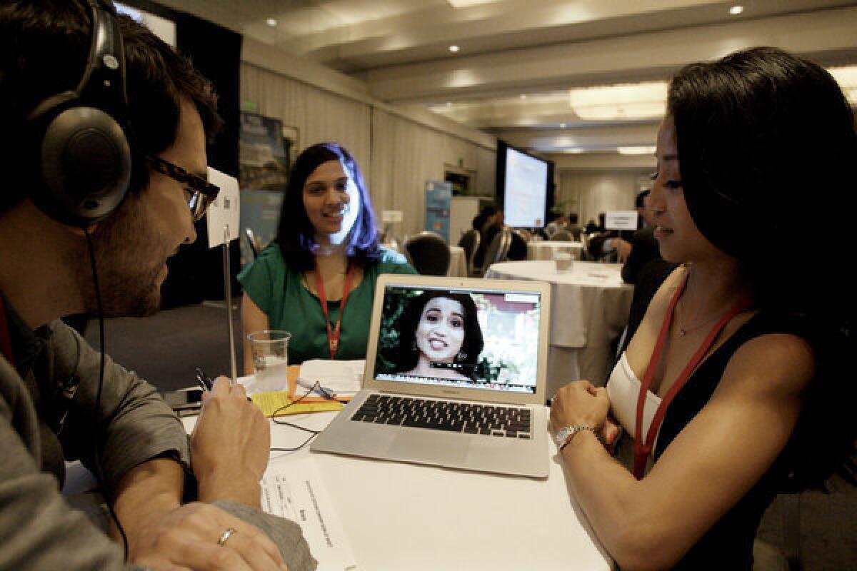 Jacqueline Bhagavan (right) and Amruta Gadgil (middle) makes their pitch of "Wild Beauty" to Jaime Davila (left) of Bravo during PitchCon.