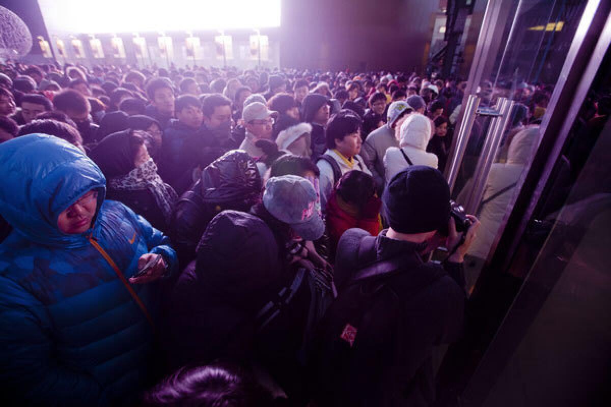 The introduction of the iPhone 4s on Jan. 13, 2012, had Chinese buyers lined up outside an Apple store in Beijing.