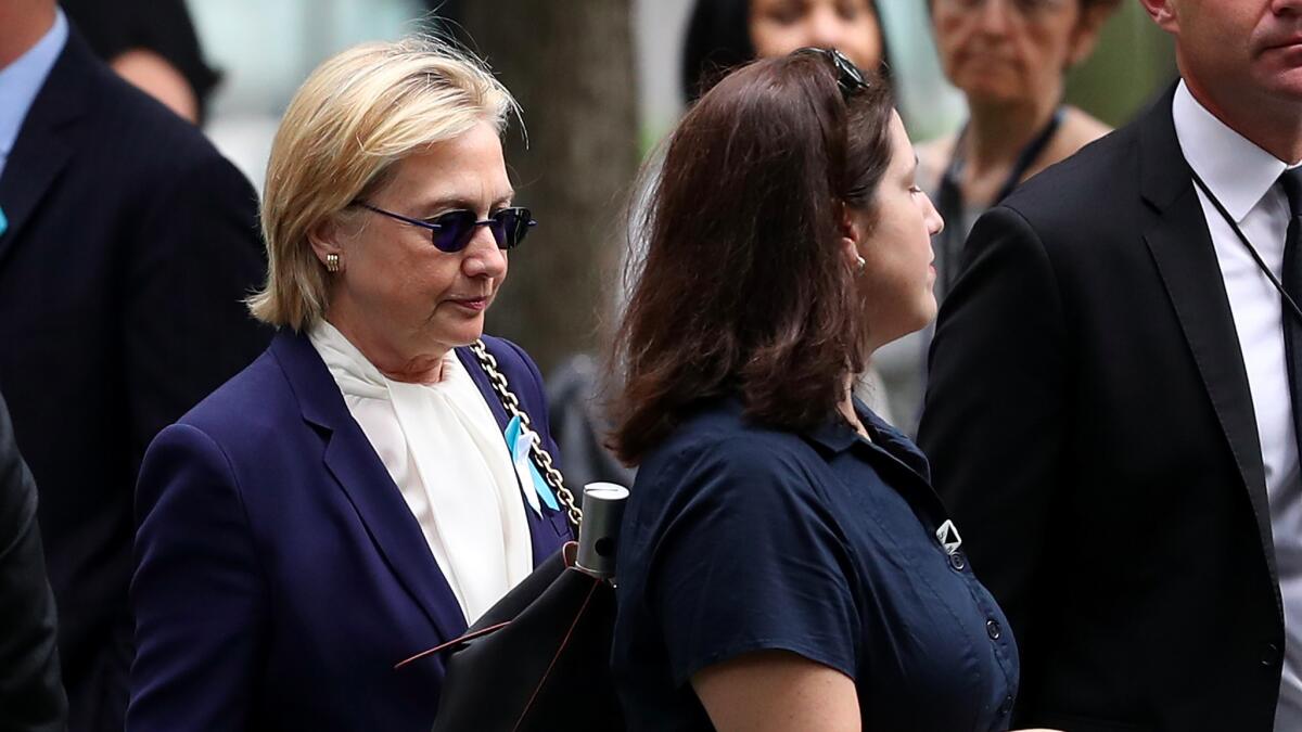 Hillary Clinton arrives at a Sept. 11 commemoration ceremony in New York on Sunday.