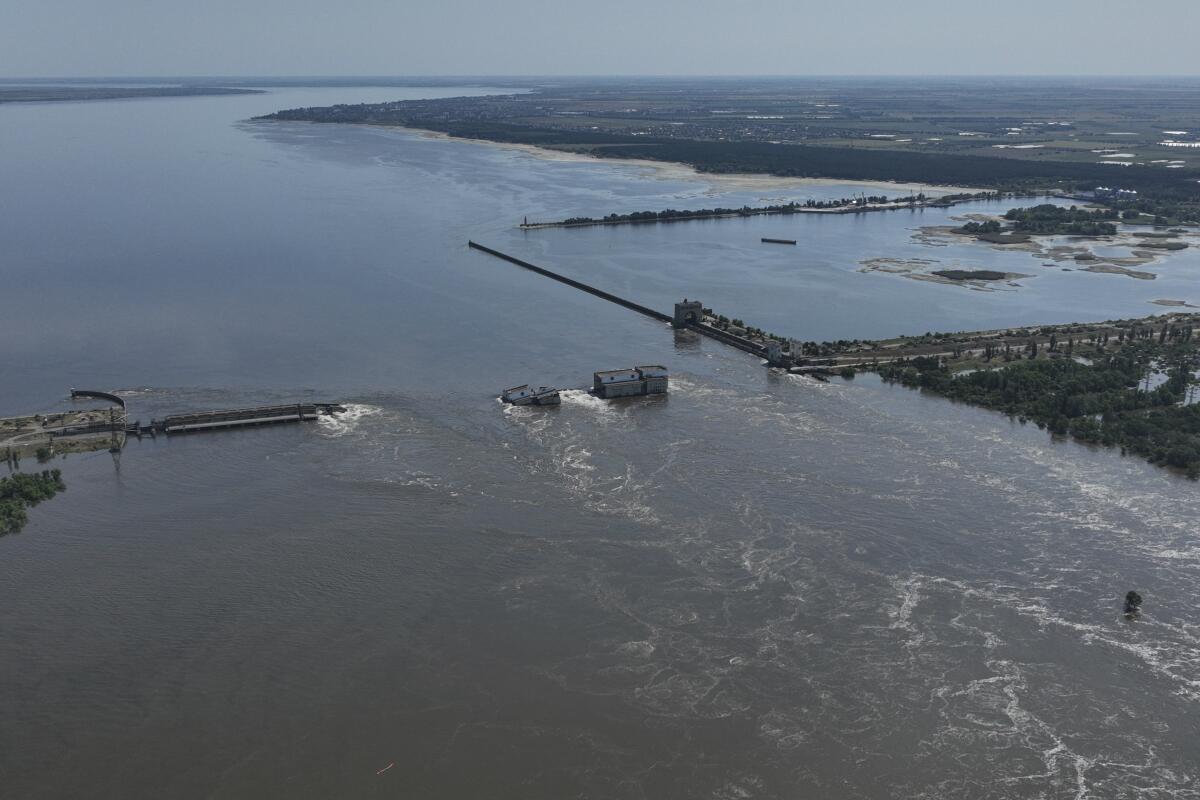 Water flowing over collapsed Kakhovka dam in Russian-occupied Ukraine