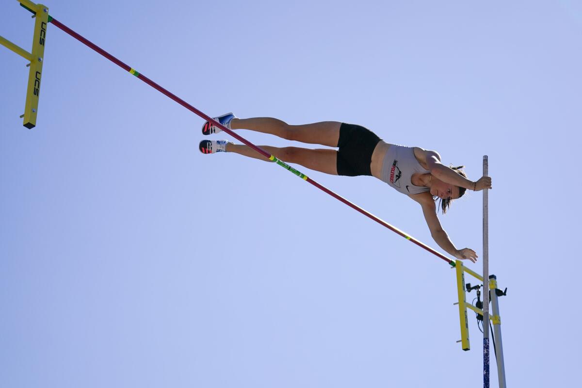 Teenager Hana Moll launches herself over the bar in the women's pole vault at the U.S. track and field championships.