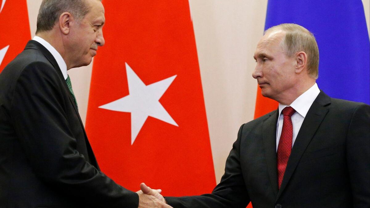 Russian President Vladimir Putin, right, and Turkish President Recep Tayyip Erdogan shake hands after a news conference following their talks in Putin's residence in the Russian Black Sea resort of Sochi, Russia, Wednesday, May 3, 2017. (Alexander Zemlianichenko / AP)