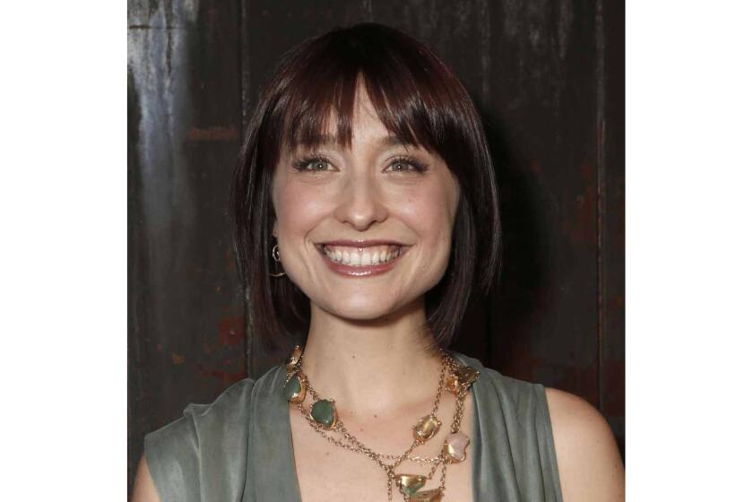 FILE - This June 26, 2012, file photo shows television actress Allison Mack at a party in Los Angeles. Federal prosecutors say television actress Allison Mack, from "Smallville" has been charged with sex trafficking for helping recruit women to be slaves of a man who sold himself as a self-improvement guru. Mack, 35, was accused in an indictment unsealed Friday in federal court in Brooklyn. She was scheduled to appear in court later Friday. (Photo by Todd Williamson/Invision/AP, File)
